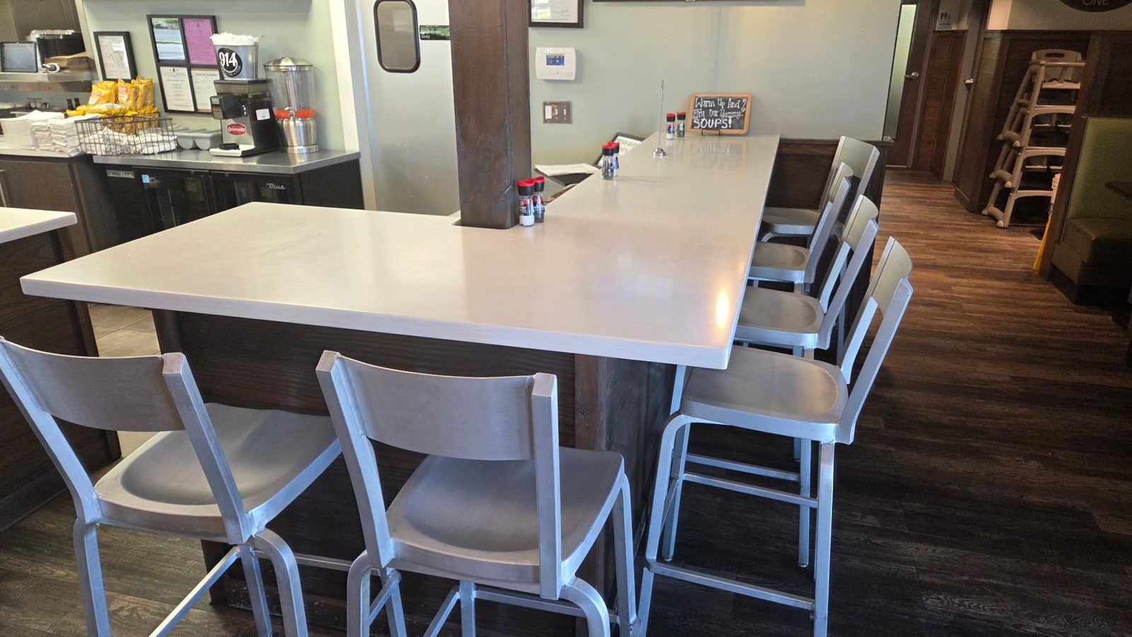 Counter seating with tall chairs inside Nine One Four